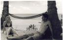 Us on the beach by our hammock.